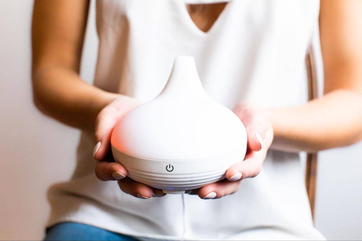 Person holding a diffuser